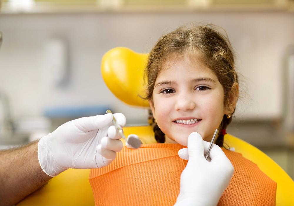 children's dentist dunedin | young girl smiling in the dental chair in dunedin
