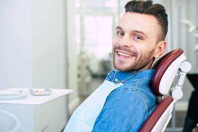 dunedin man smiling in dental chair