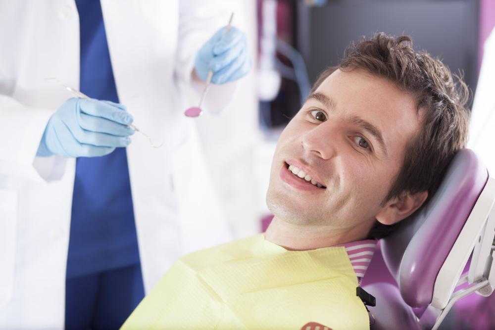 man smiling in dental chair