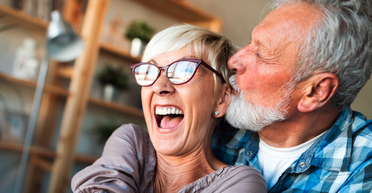 Couple smiling at family dental practice in Dunedin, NZ
