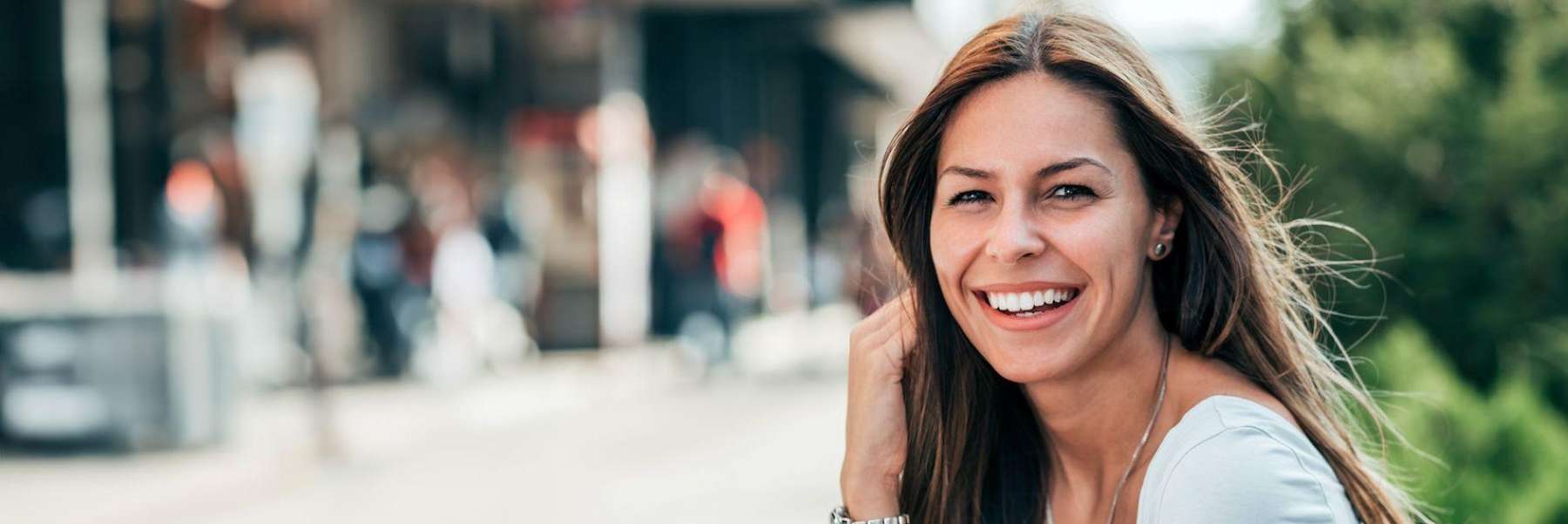 dysport dunedin | woman smiling while sitting outside