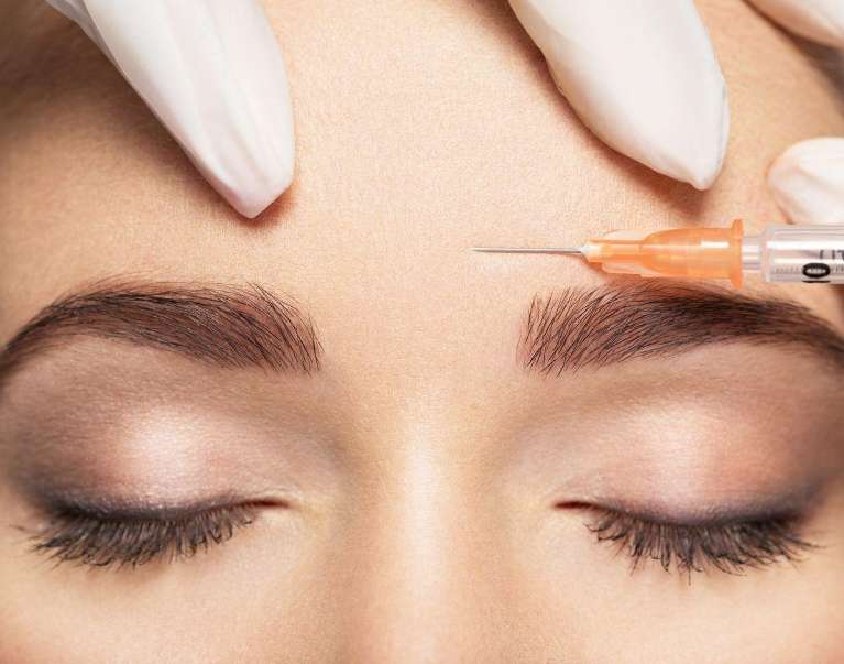 dysport cosmetic injectables | woman getting dysport 