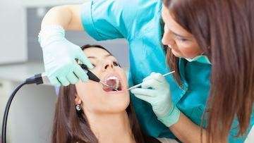 patient getting a dental clean in Dunedin