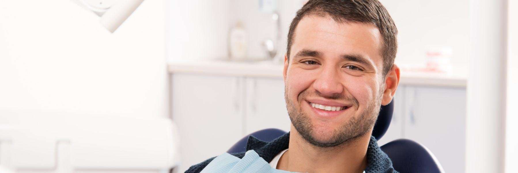 oral health dunedin | man smiling